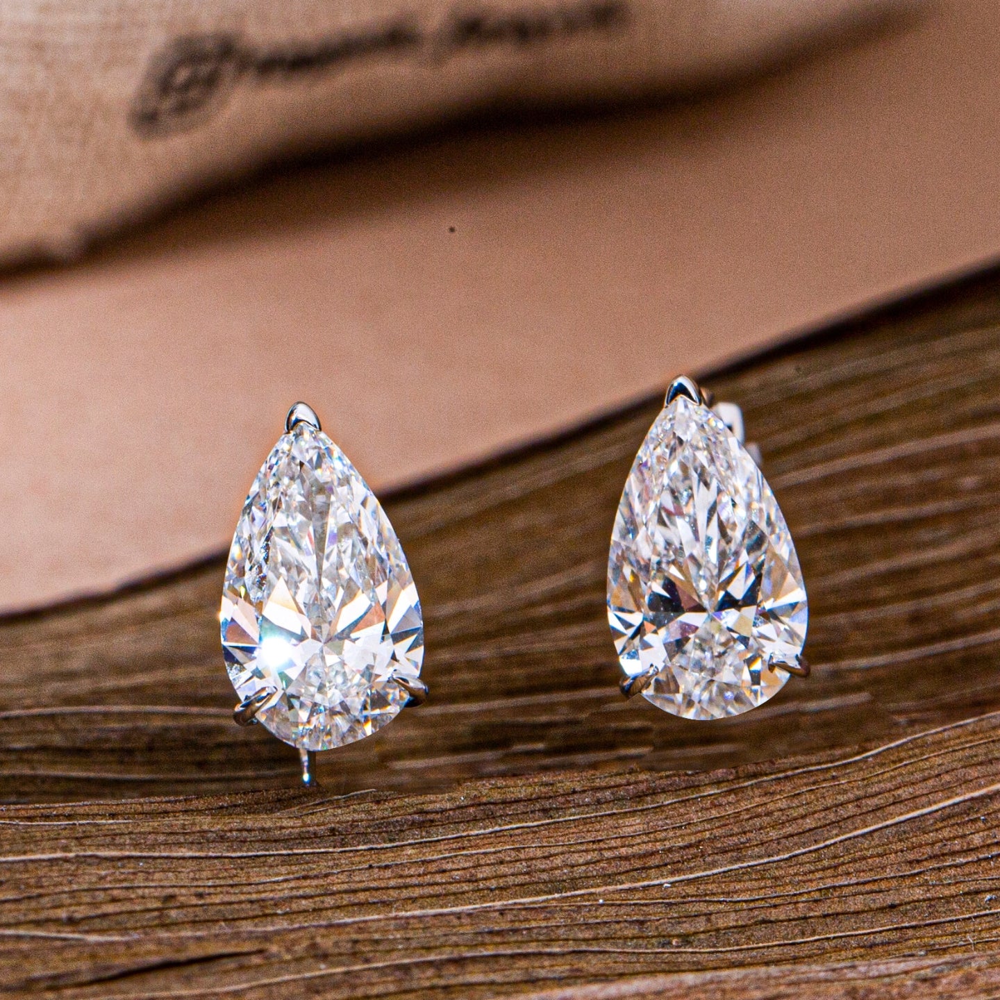 Pear Cut Diamond Huggie Drop Earrings.